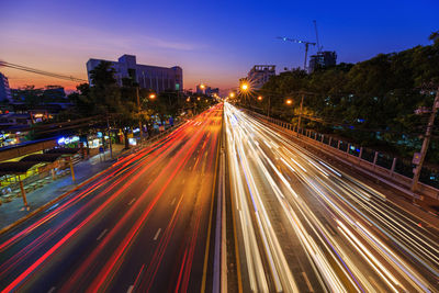High angle view of light trails on road at night