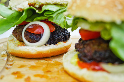 Close-up of burgers on cutting board