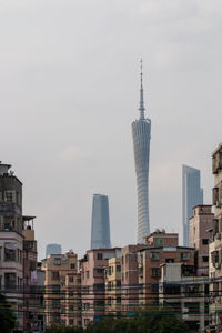 Modern buildings in city against sky