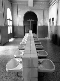 Empty chairs in corridor