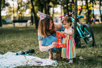 Mother and daughter on tree