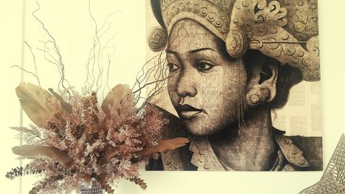 Close-up portrait of young man against plants