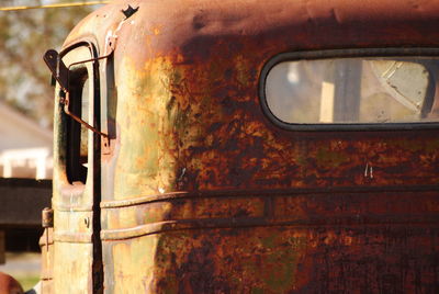 Close-up of rusty abandoned car