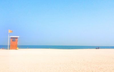 View of beach against blue sky