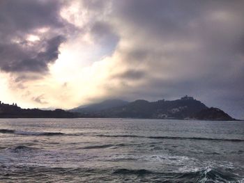 Scenic view of sea against cloudy sky