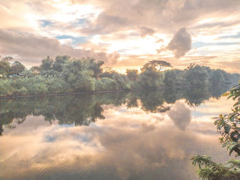 Scenic view of lake against sky during sunset