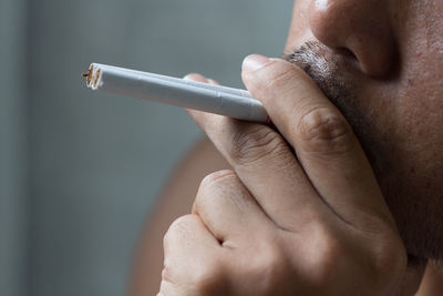 Close-up of man smoking cigarettes