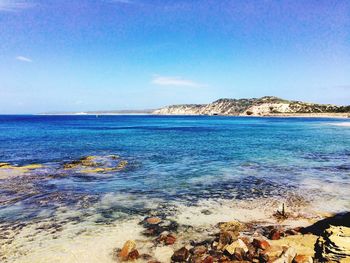 Scenic view of sea against blue sky