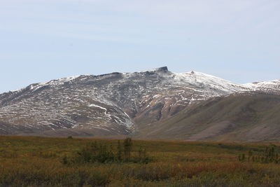 Scenic view of snowcapped mountains against sky