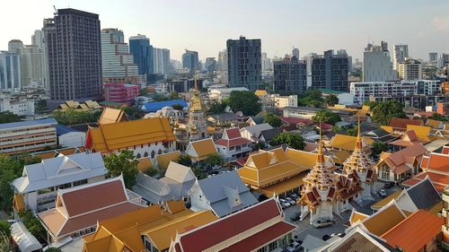 High angle view of buildings in city against sky