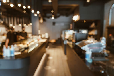 Defocused image of empty chairs and table in restaurant