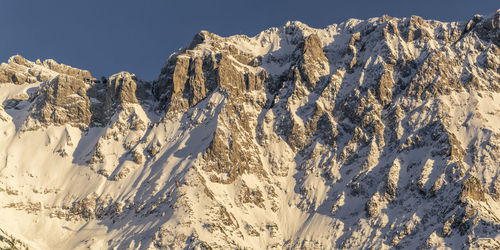 Panoramic view of snowcapped mountains against sky