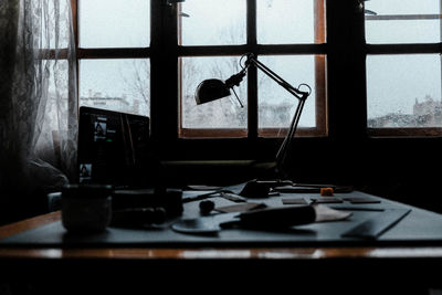Close-up of electric lamp on table