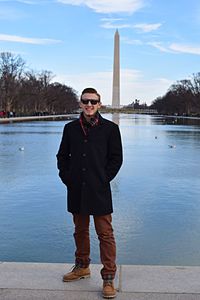 Portrait of man standing in city