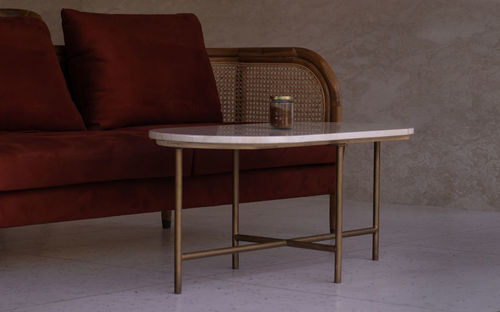 Empty chairs and table against wall at home