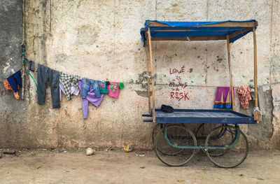 Old cart and drying clothes