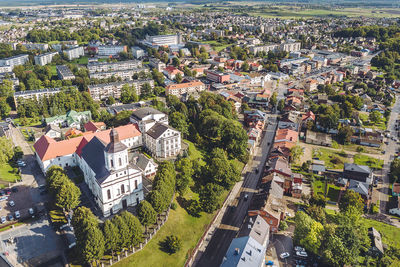 High angle view of houses and trees in city