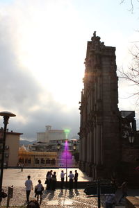 People at town square against sky