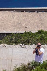 Man photographing with camera