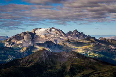 Scenic view of dolomites against cloudy sky