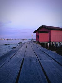 Scenic view of wooden jetty path against clear sky