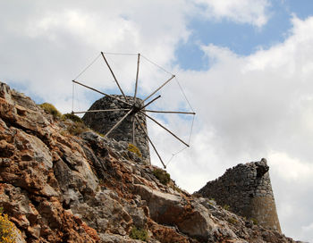 Low angle view of rock formation against sky