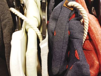 Close-up of clothes hanging in store for sale