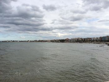 View of city against cloudy sky