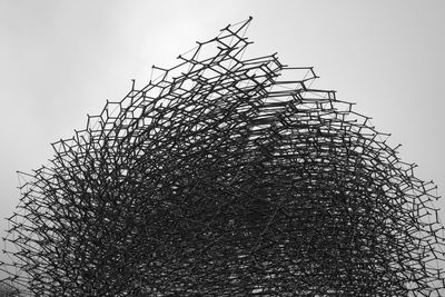 Low angle view of barbed wire against sky