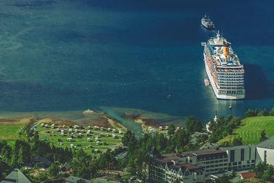 Aerial view of buildings by sea