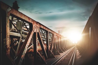 View of railroad tracks against cloudy sky