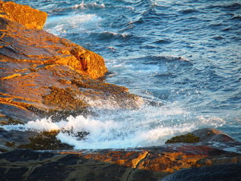 Sea waves splashing on rocks