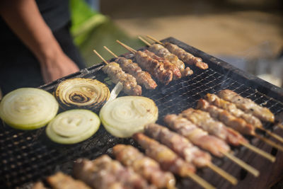 Cropped hand of man preparing food