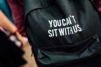 Close-up of backpack with text
