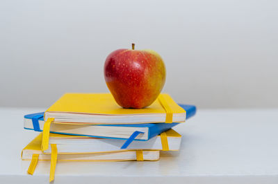 Close-up of red apple on table