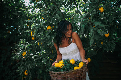 Young woman holding ice cream in basket