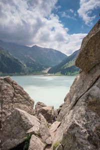 Scenic view of lake and mountains against sky