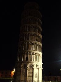 Low angle view of illuminated building at night