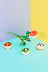 Close-up of candies on table against blue background