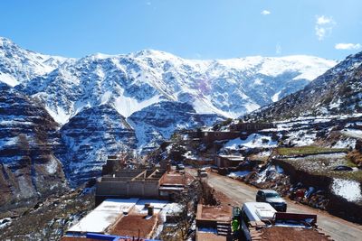 Aerial view of snowcapped mountains against sky