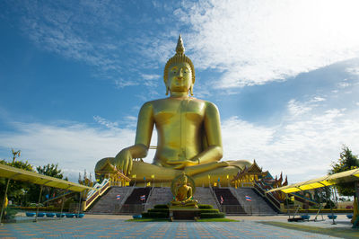 Low angle view of large buddha statue