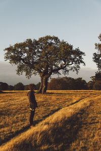 Person standing in grassy field