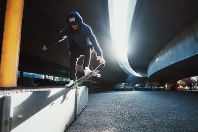 Low angle view of man balancing on skateboard
