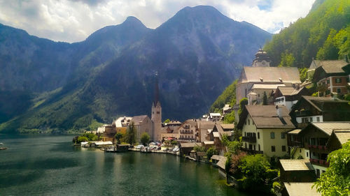 Panoramic view of buildings and mountains against sky