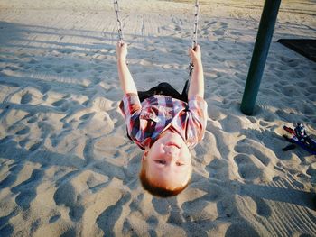 High angle view of happy girl playing on playground