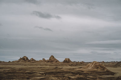 Rock formations in desert against sky