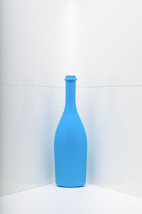 High angle view of wine bottles against white background