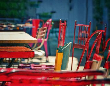 Close-up of empty chairs and table in cafe