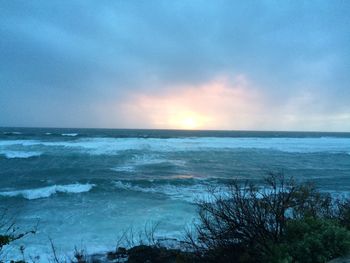 Scenic view of sea at sunset