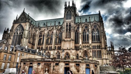 Low angle view of cathedral against cloudy sky